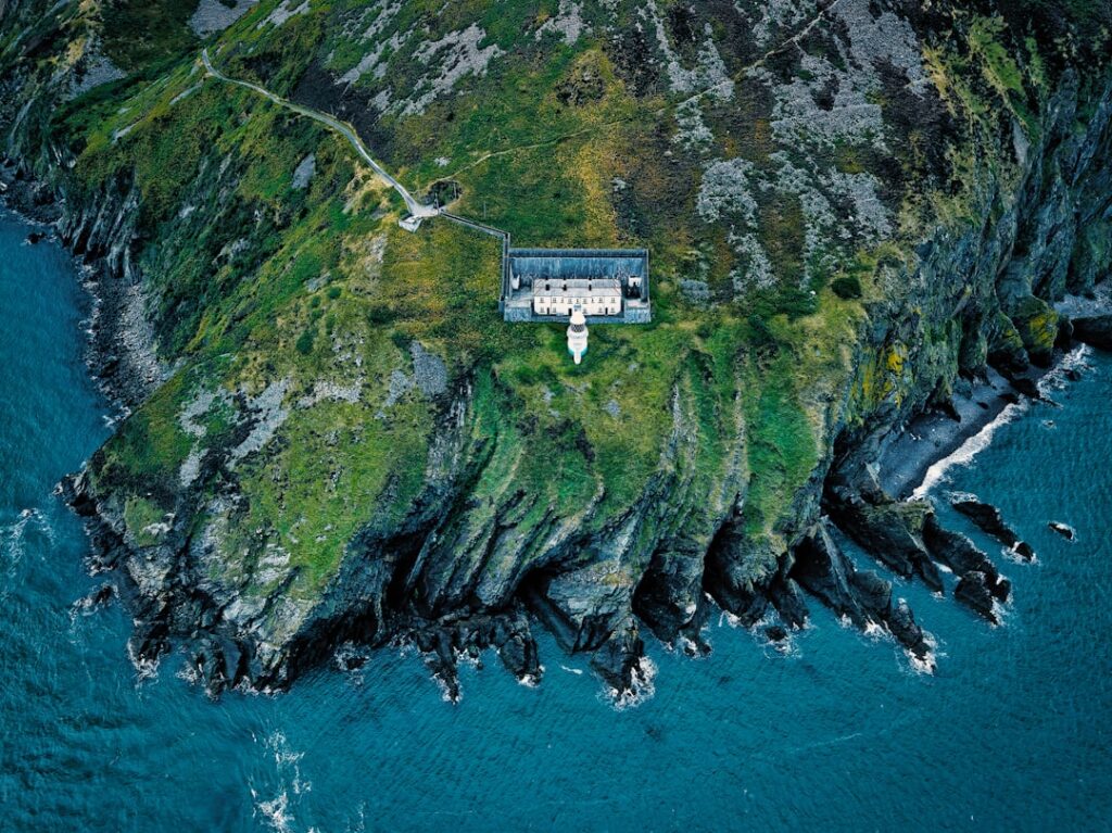 Remote house on a green, rocky island by the sea